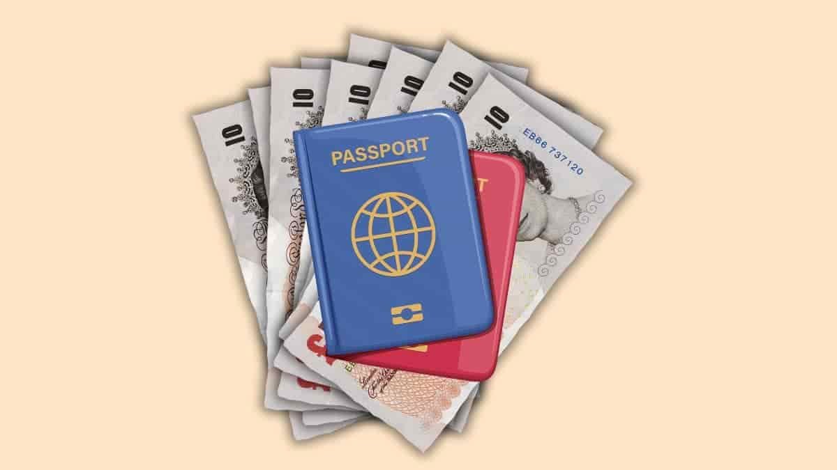 passports on top of a selection of £10 notes